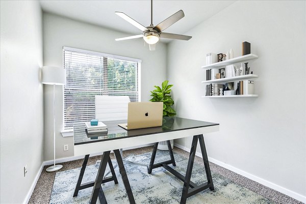 Cozy bedroom with modern decor at The Dylan Apartments in vibrant city setting