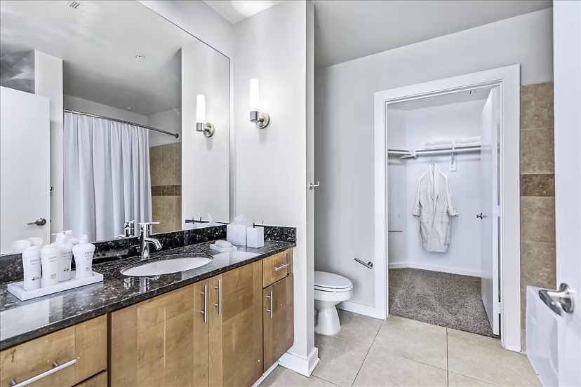 Modern bathroom featuring sleek fixtures and marble countertops at The Dylan Apartments