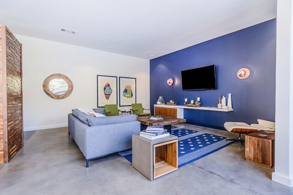 Clubhouse lobby featuring modern decor and seating at The Dylan Apartments