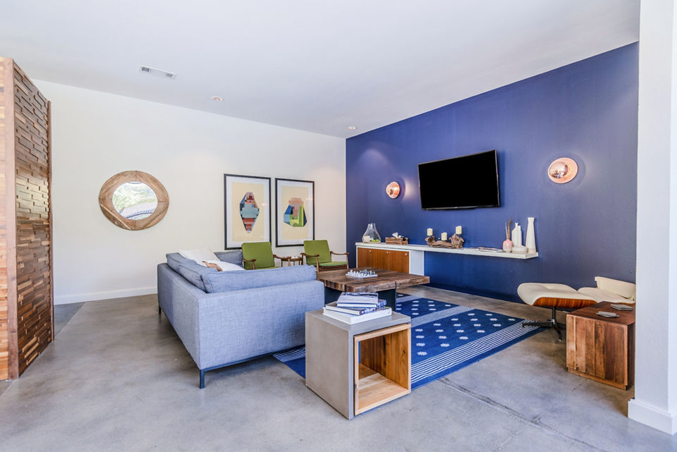 Clubhouse lobby featuring modern decor and seating at The Dylan Apartments