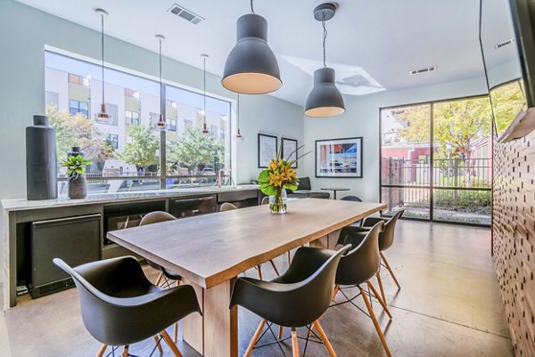 Contemporary clubhouse kitchen featuring sleek countertops and modern appliances at The Dylan Apartments