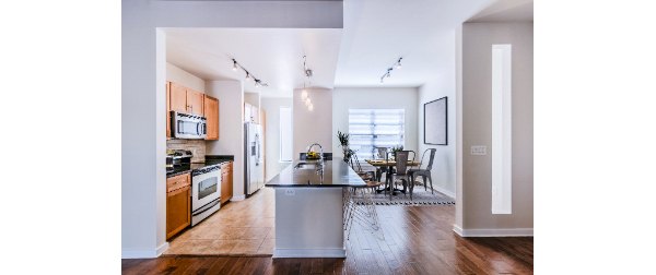 Dining room with elegant decor and large windows at The Dylan Apartments