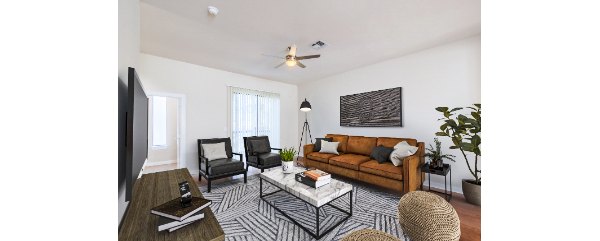 Inviting living room with modern decor and ample natural light at The Dylan Apartments, offering a luxurious lifestyle experience