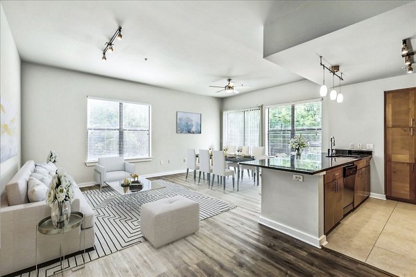 Modern living room with sleek furniture and large windows at The Dylan Apartments