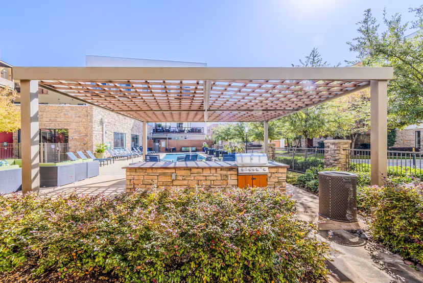 Grill area on modern patio at The Dylan Apartments with outdoor seating options