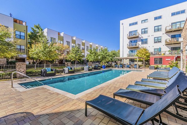 Sparkling outdoor pool oasis at The Dylan Apartments, offering luxury relaxation for residents