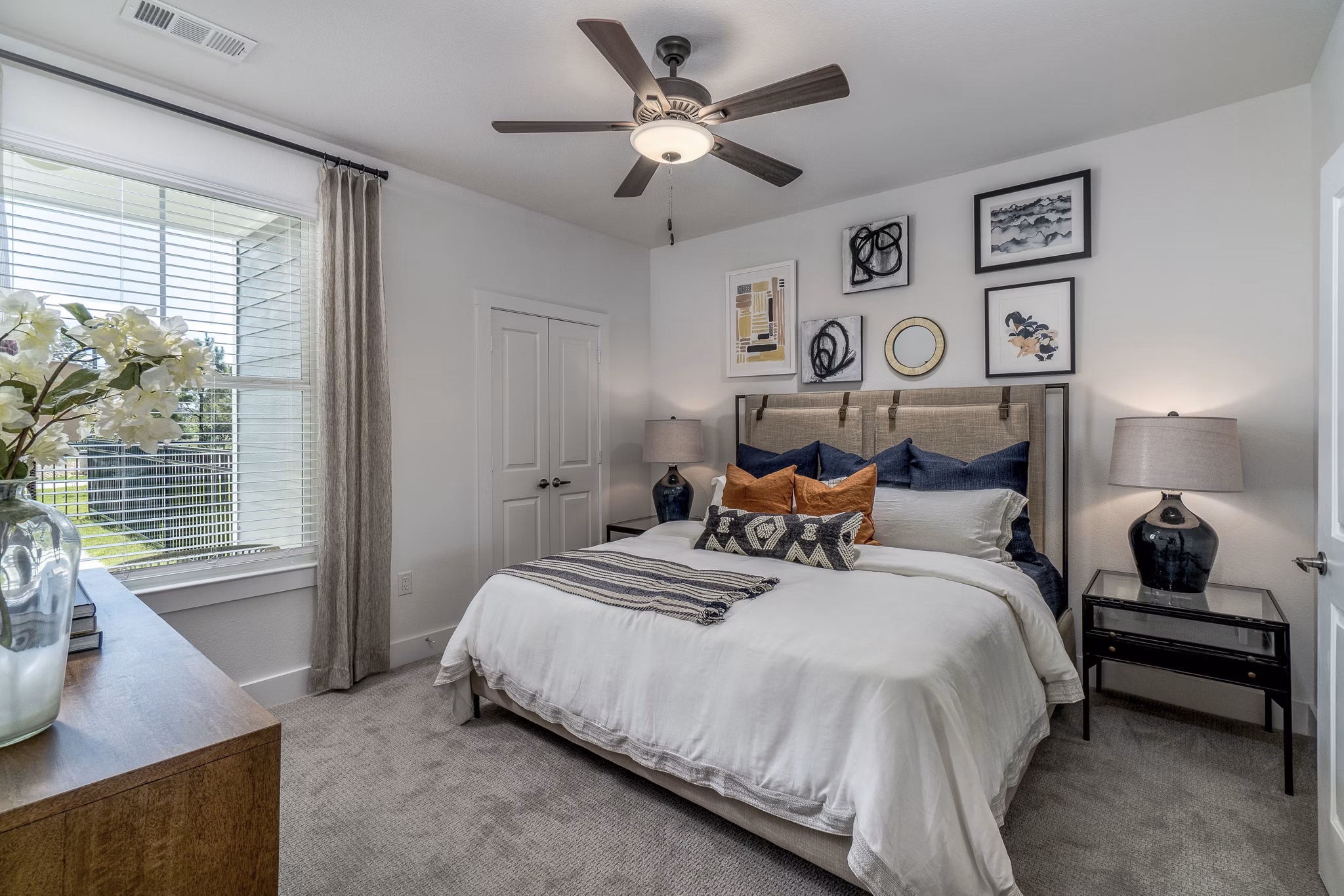 Cozy bedroom with modern decor at Lakeside Row Apartments