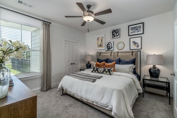 Cozy bedroom with modern decor at Lakeside Row Apartments