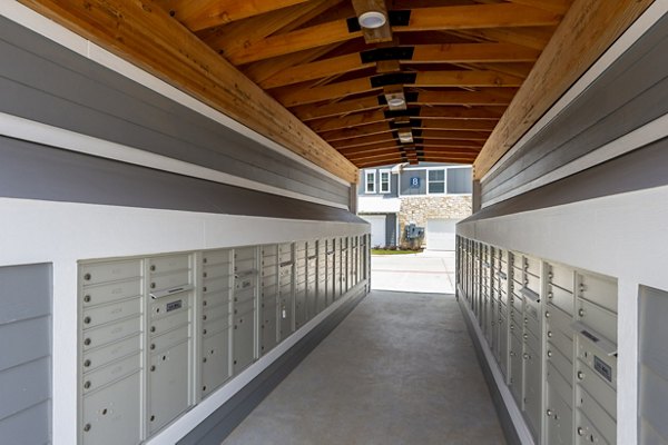 Mail room with organized parcel lockers at Lakeside Row Apartments