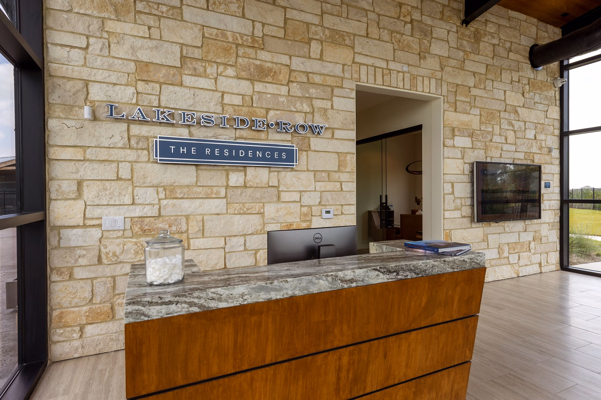 Clubhouse with modern decor and cozy seating at Lakeside Row Apartments