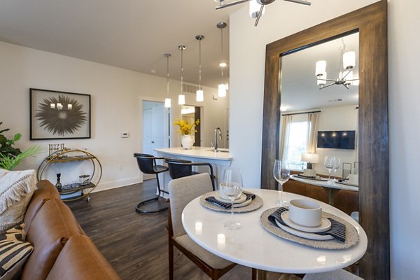 Dining room with modern decor and large windows in Lakeside Row Apartments