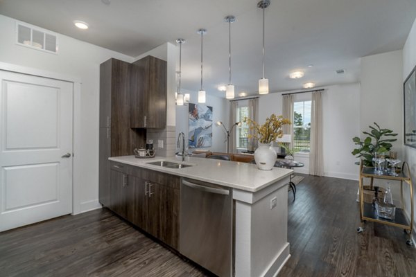 Modern kitchen featuring stainless steel appliances at Lakeside Row Apartments