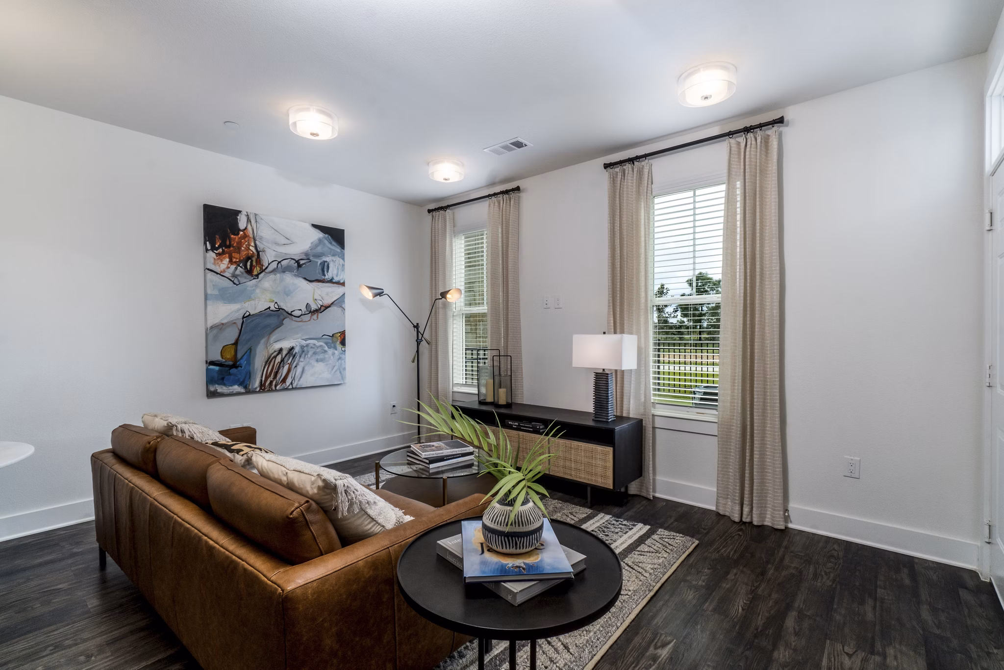 Spacious living room with modern decor at Lakeside Row Apartments