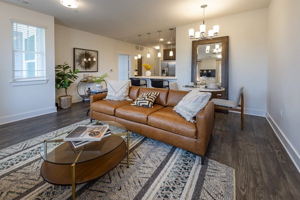 Spacious living room with modern decor and natural light at Lakeside Row Apartments