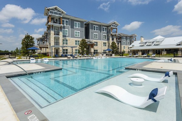 Inviting poolside oasis at Lakeside Row Apartments, perfect for relaxation and recreation within a luxury living experience
