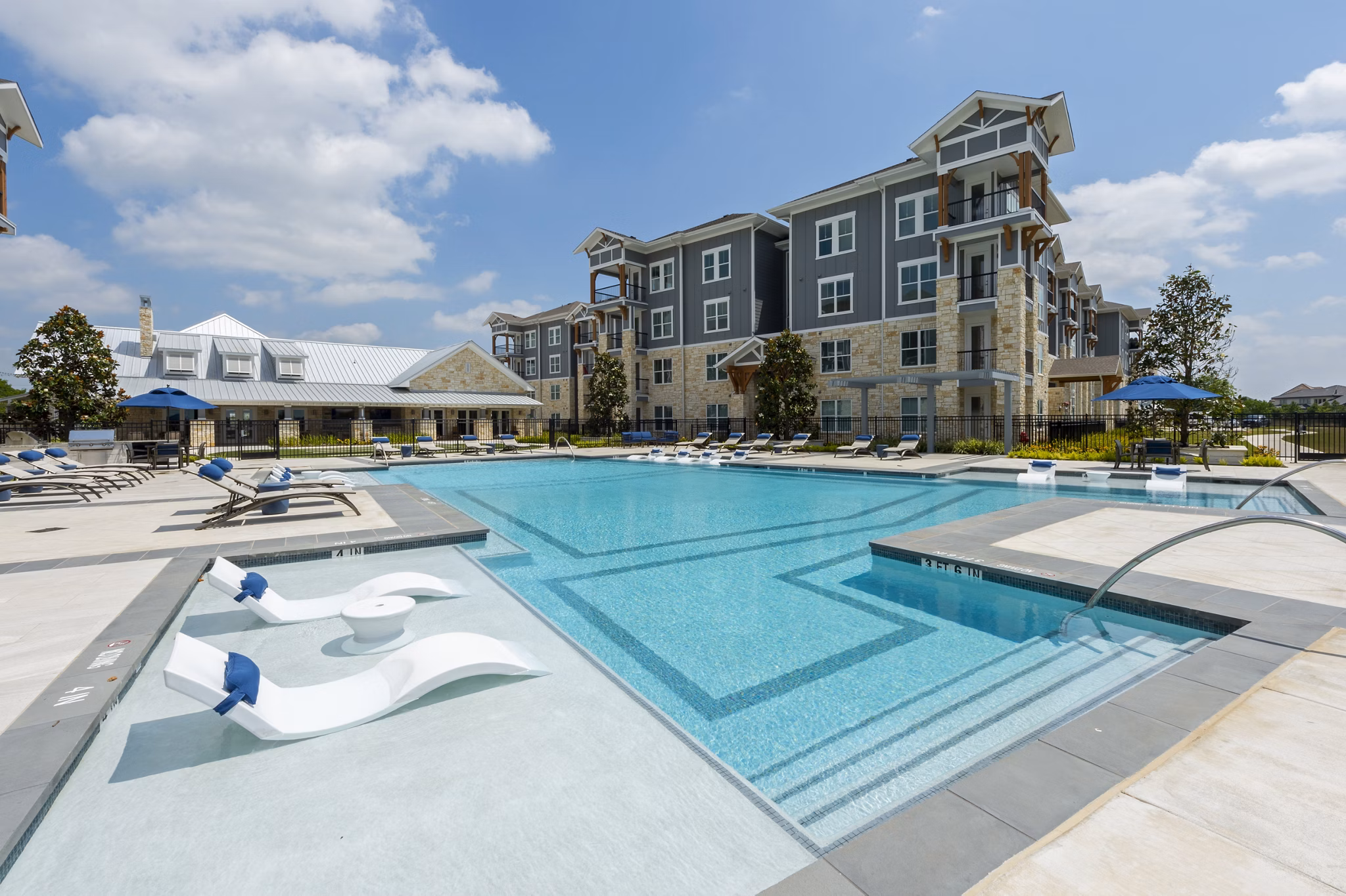 Sparkling outdoor pool at Lakeside Row Apartments offering resort-style relaxation
