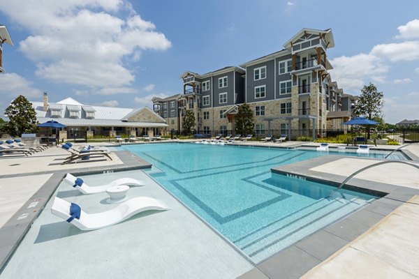 Sparkling outdoor pool at Lakeside Row Apartments offering resort-style relaxation