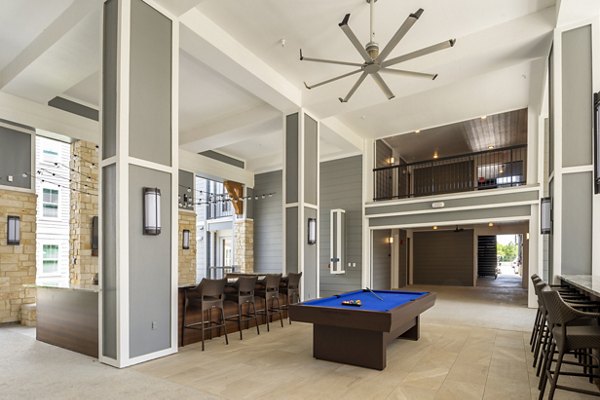 Outdoor patio with stylish seating at Lakeside Row Apartments, perfect for relaxation and social gatherings