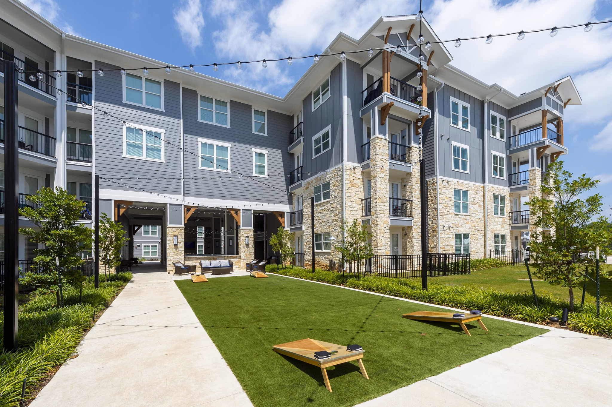 Outdoor recreational patio with cozy seating and lake views at Lakeside Row Apartments