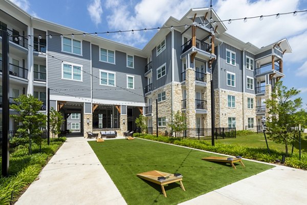 Outdoor recreational patio with cozy seating and lake views at Lakeside Row Apartments