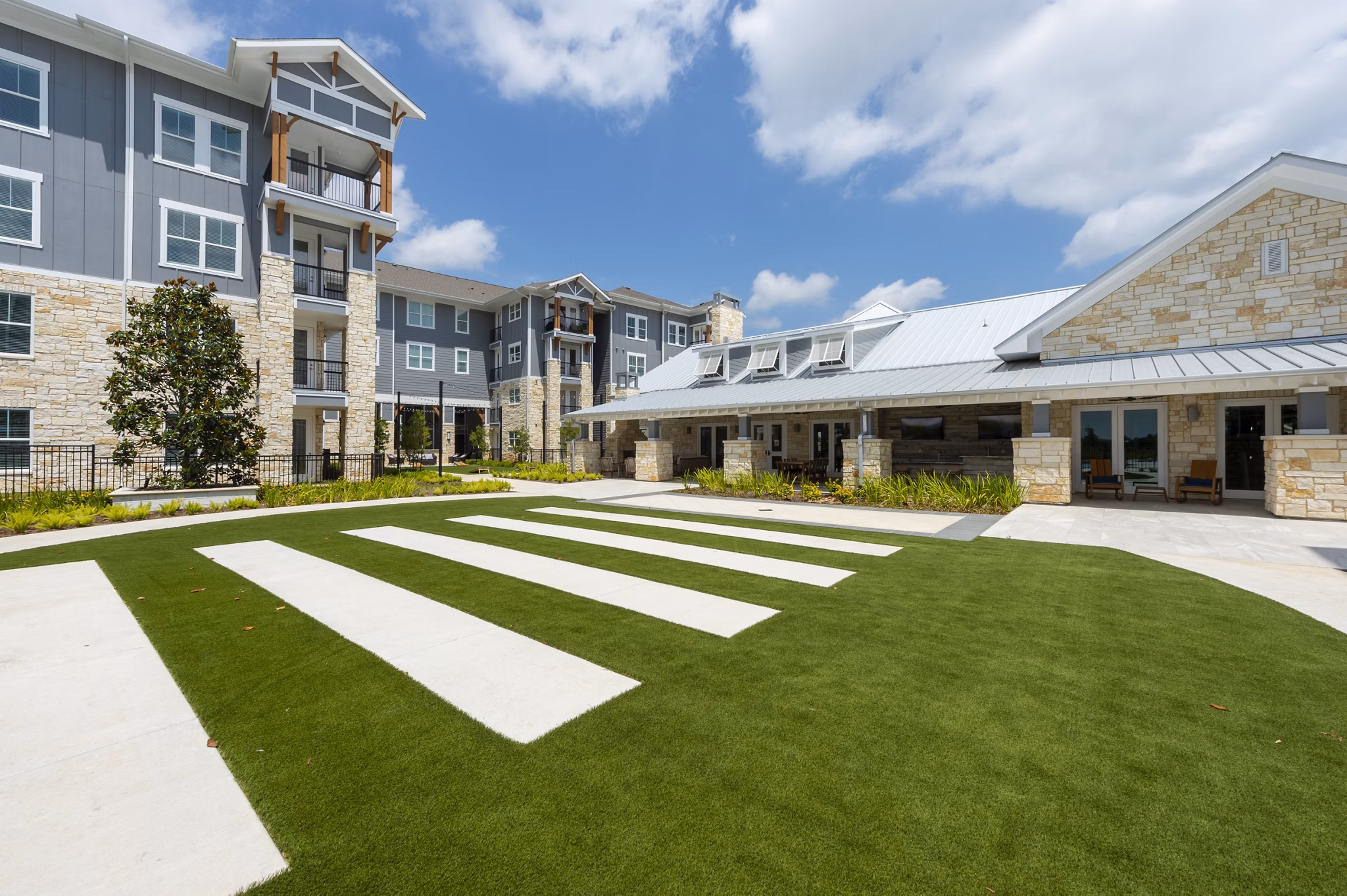 Patio with modern seating and scenic views at Lakeside Row Apartments, a luxury Greystar community
