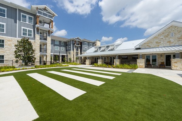 Patio with modern seating and scenic views at Lakeside Row Apartments, a luxury Greystar community