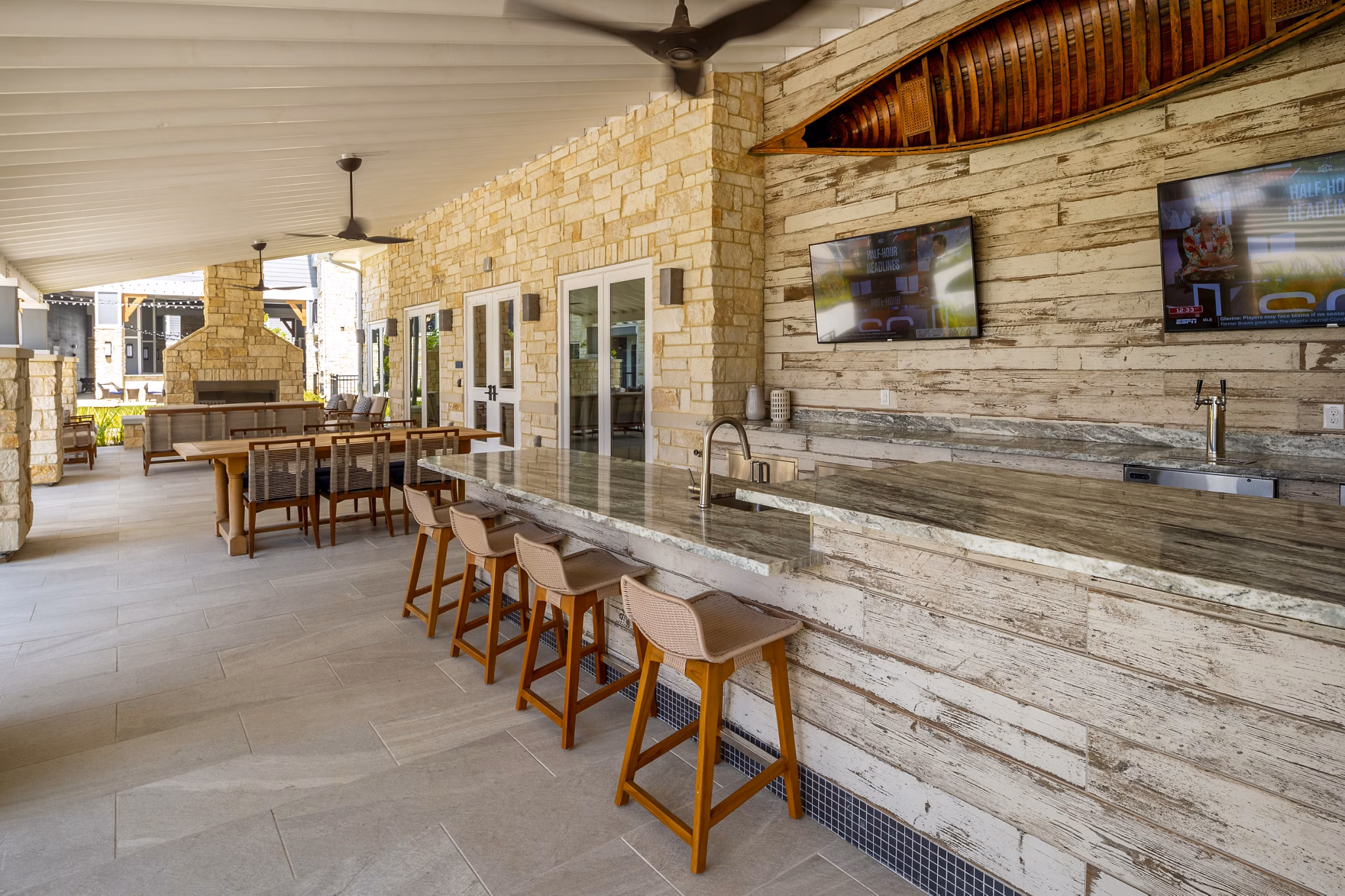 Patio with modern seating and lake views at Lakeside Row Apartments, luxury apartments by Greystar