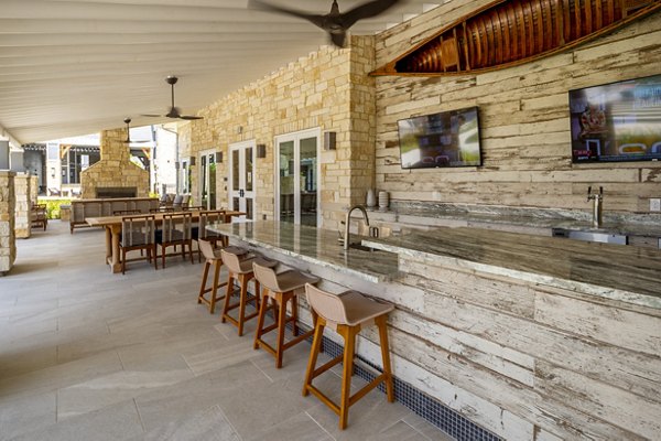 Patio with modern seating and lake views at Lakeside Row Apartments, luxury apartments by Greystar