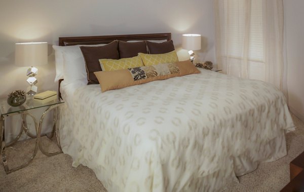 Cozy bedroom with modern decor at The Millennium Six Pines Apartments