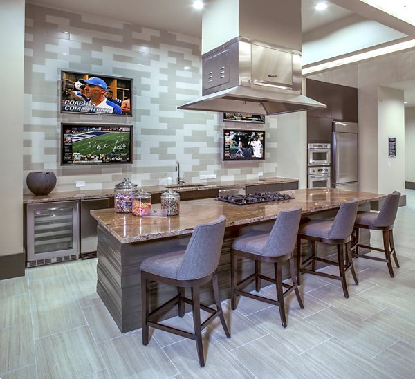 Clubhouse featuring modern decor and ample seating at The Millennium Six Pines Apartments