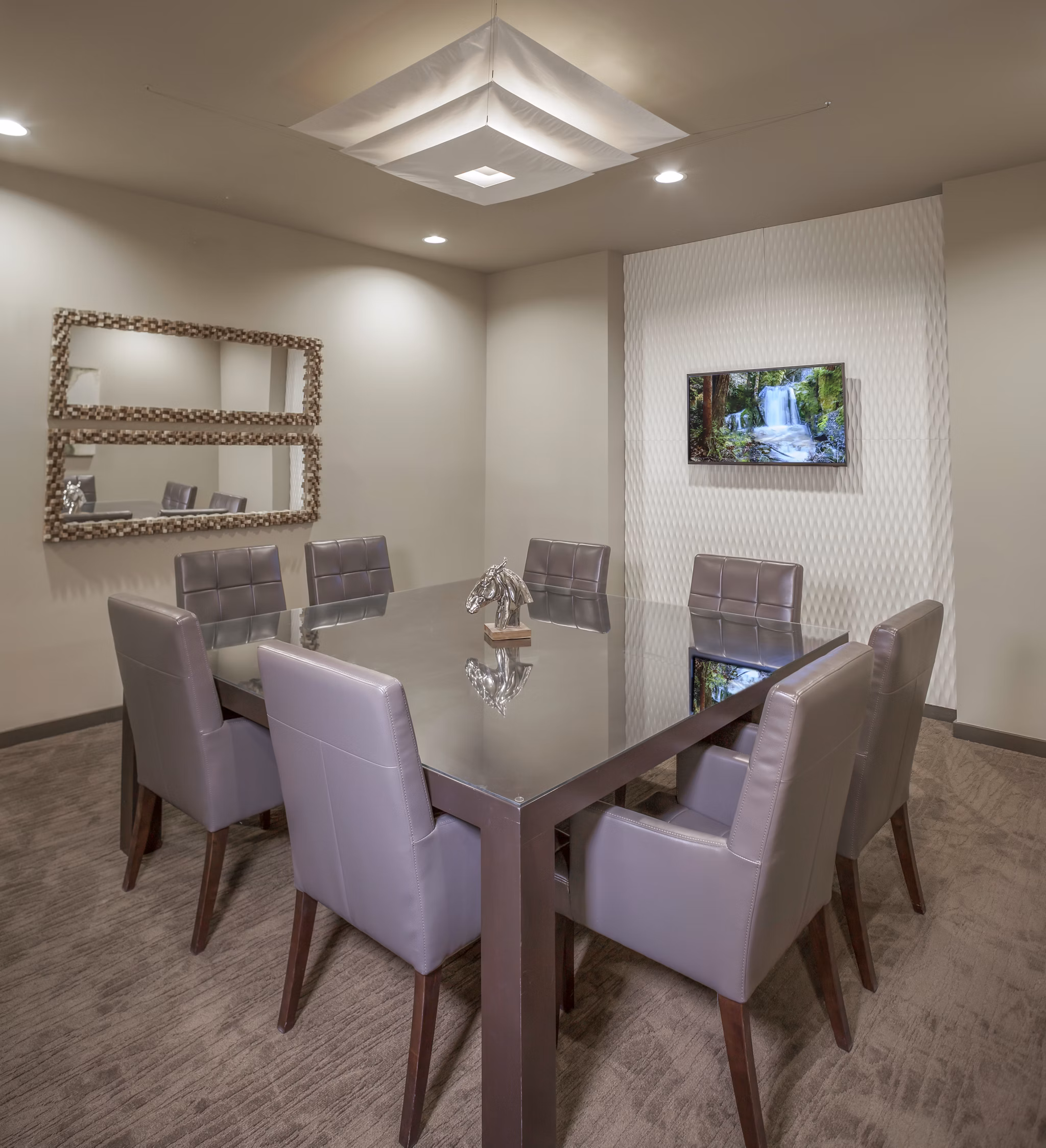 Meeting room with modern design and seating at The Millennium Six Pines Apartments, ideal for conferences and gatherings