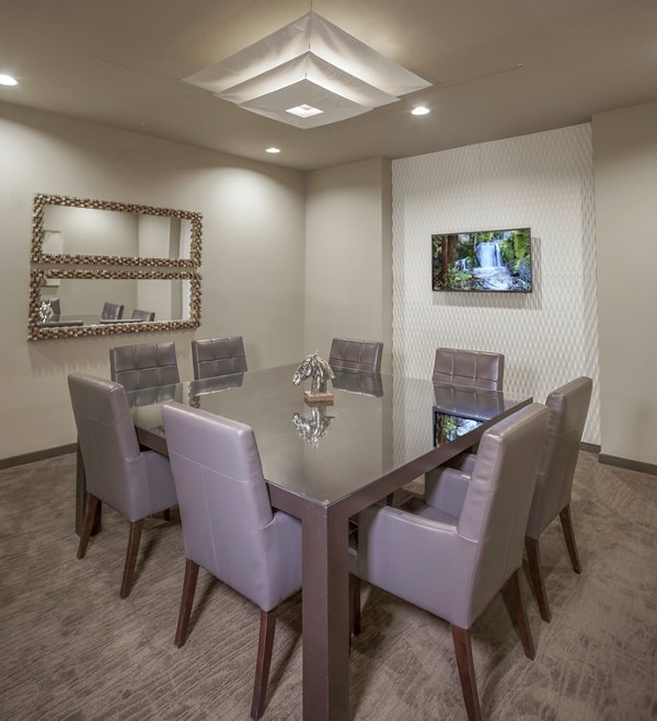 Meeting room with modern design and seating at The Millennium Six Pines Apartments, ideal for conferences and gatherings