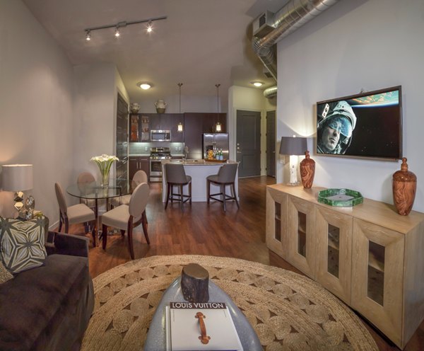 Spacious living room with modern decor in The Millennium Six Pines Apartments, perfect for luxury living