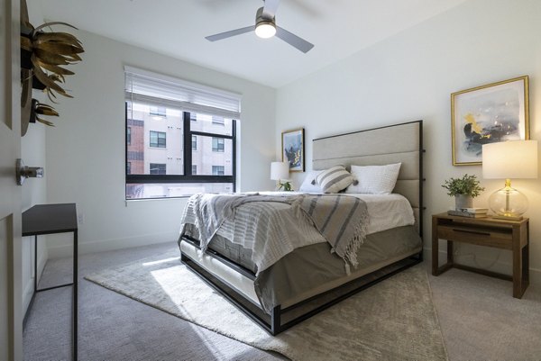 Cozy bedroom with modern decor at The Lane at Waterway Apartments