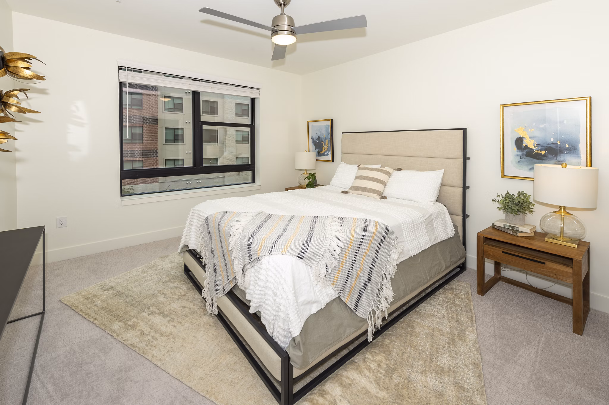 Bedroom featuring elegant decor and natural light in The Lane at Waterway Apartments