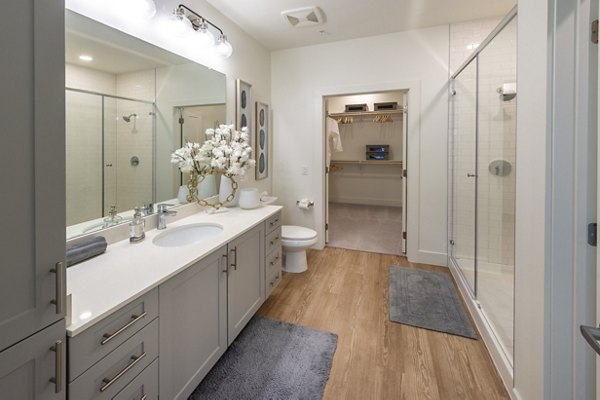 Bathroom featuring modern fixtures and sleek design at The Lane at Waterway Apartments