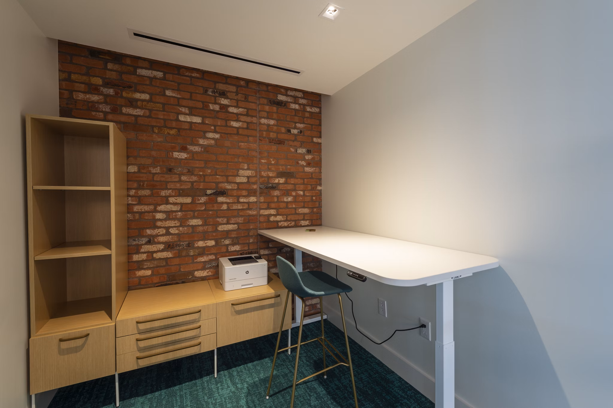 Business center with modern workstations at The Lane at Waterway Apartments, ideal for remote work and productivity in a luxury setting