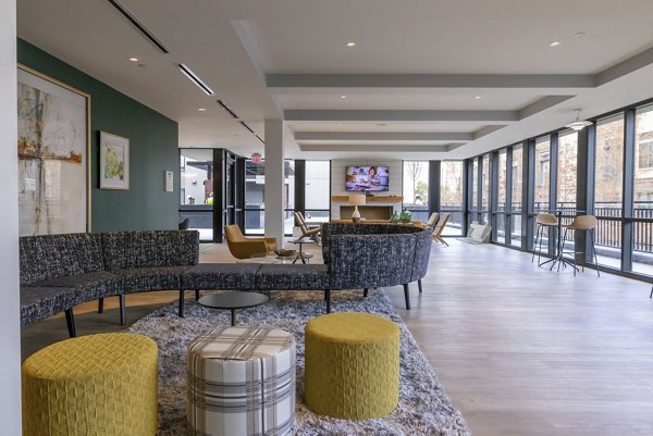 Clubhouse with modern design at The Lane at Waterway Apartments featuring social spaces and games