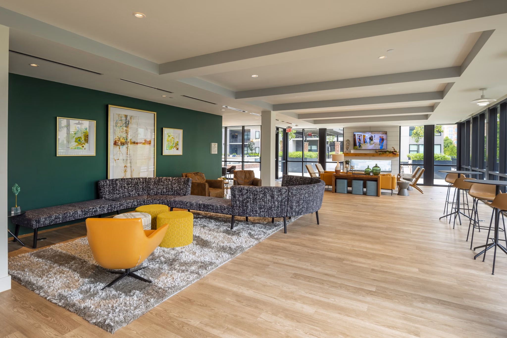 Clubhouse with modern design and pool tables at The Lane at Waterway Apartments, offering luxury living and social spaces