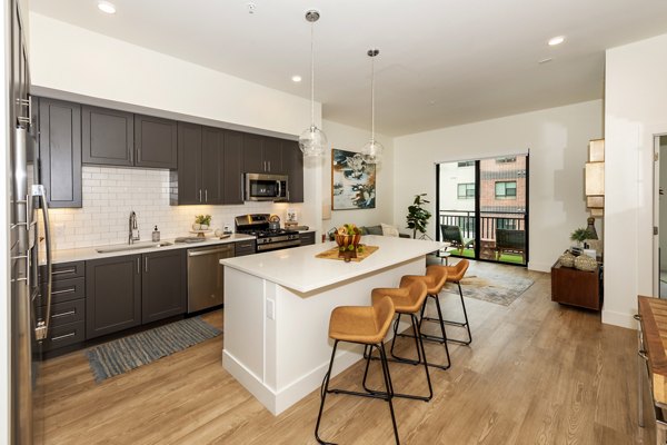 Kitchen featuring modern appliances at The Lane at Waterway Apartments