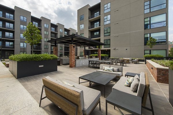 The Lane at Waterway: Tranquil courtyard space with lush greenery, ideal for relaxation and community gatherings at luxury apartments