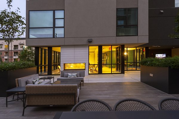 Courtyard featuring lush landscaping and seating areas at The Lane at Waterway Apartments