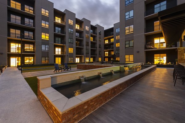 The Lane at Waterway: Lush courtyard with modern seating areas for relaxation and gatherings, enhancing luxury living in urban apartments