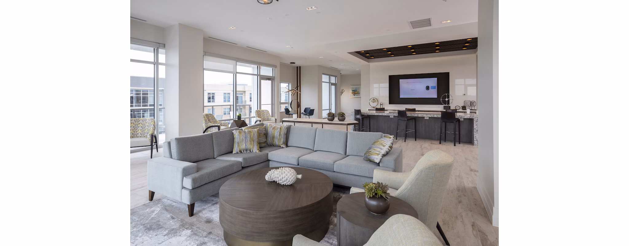 Modern clubhouse with cozy seating and pool tables at Two Lakes Edge Apartments