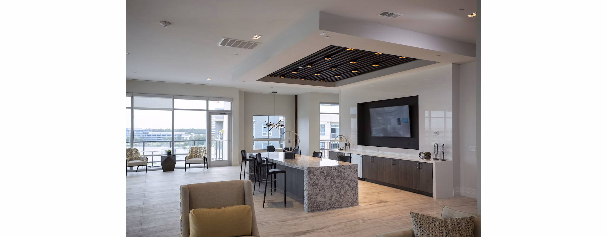 Clubhouse featuring modern design and open seating at Two Lakes Edge Apartments