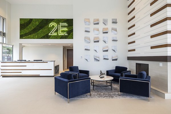Clubhouse featuring modern design and spacious seating at Two Lakes Edge Apartments
