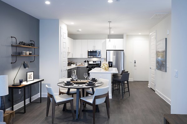 Dining area with elegant lighting and modern furnishings at Two Lakes Edge Apartments
