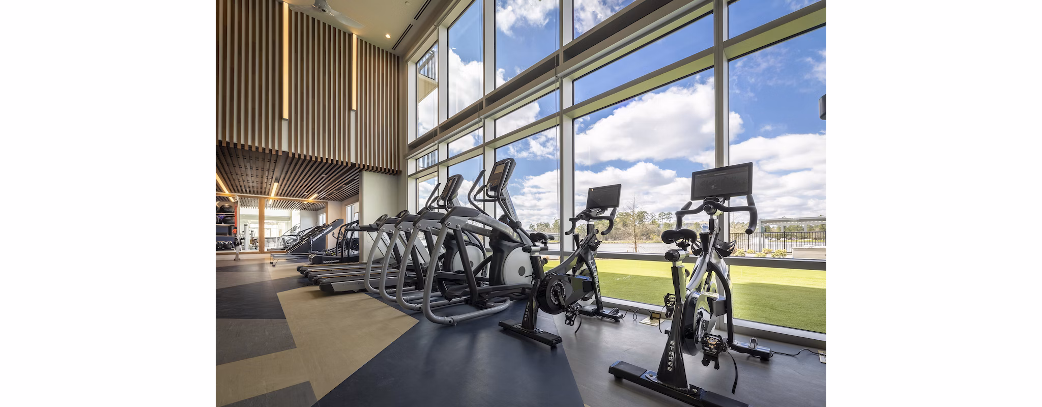 State-of-the-art fitness center with modern equipment at Two Lakes Edge Apartments Enjoy luxurious living and health-focused amenities