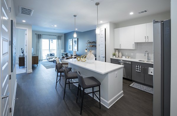Modern kitchen with stainless steel appliances at Two Lakes Edge Apartments