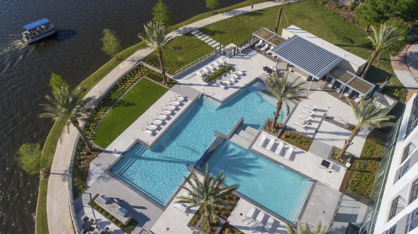 Poolside relaxation area with a modern design at Two Lakes Edge Apartments, perfect for leisure and enjoying sunny days